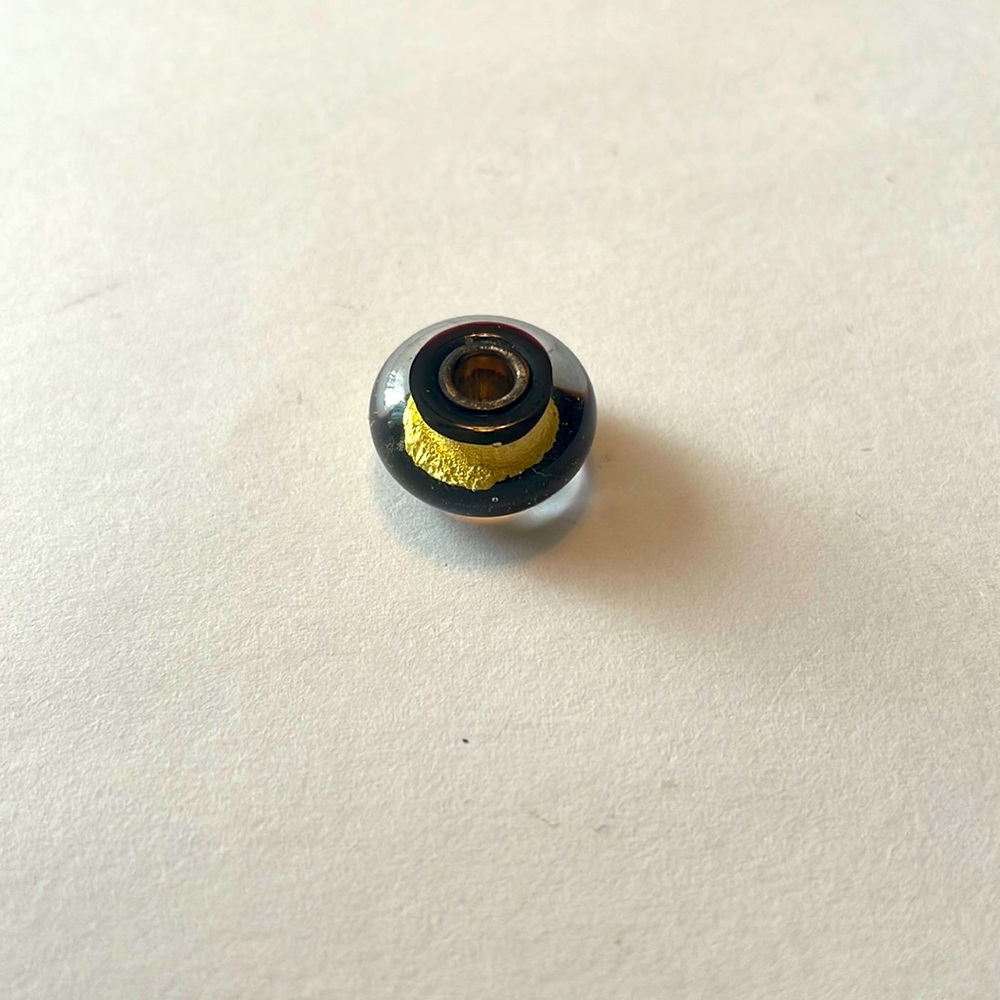 Trollbeads black and gold chakra bead. New.